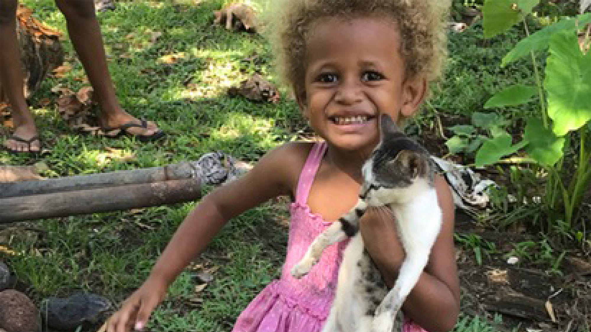 Little girl with a kitten