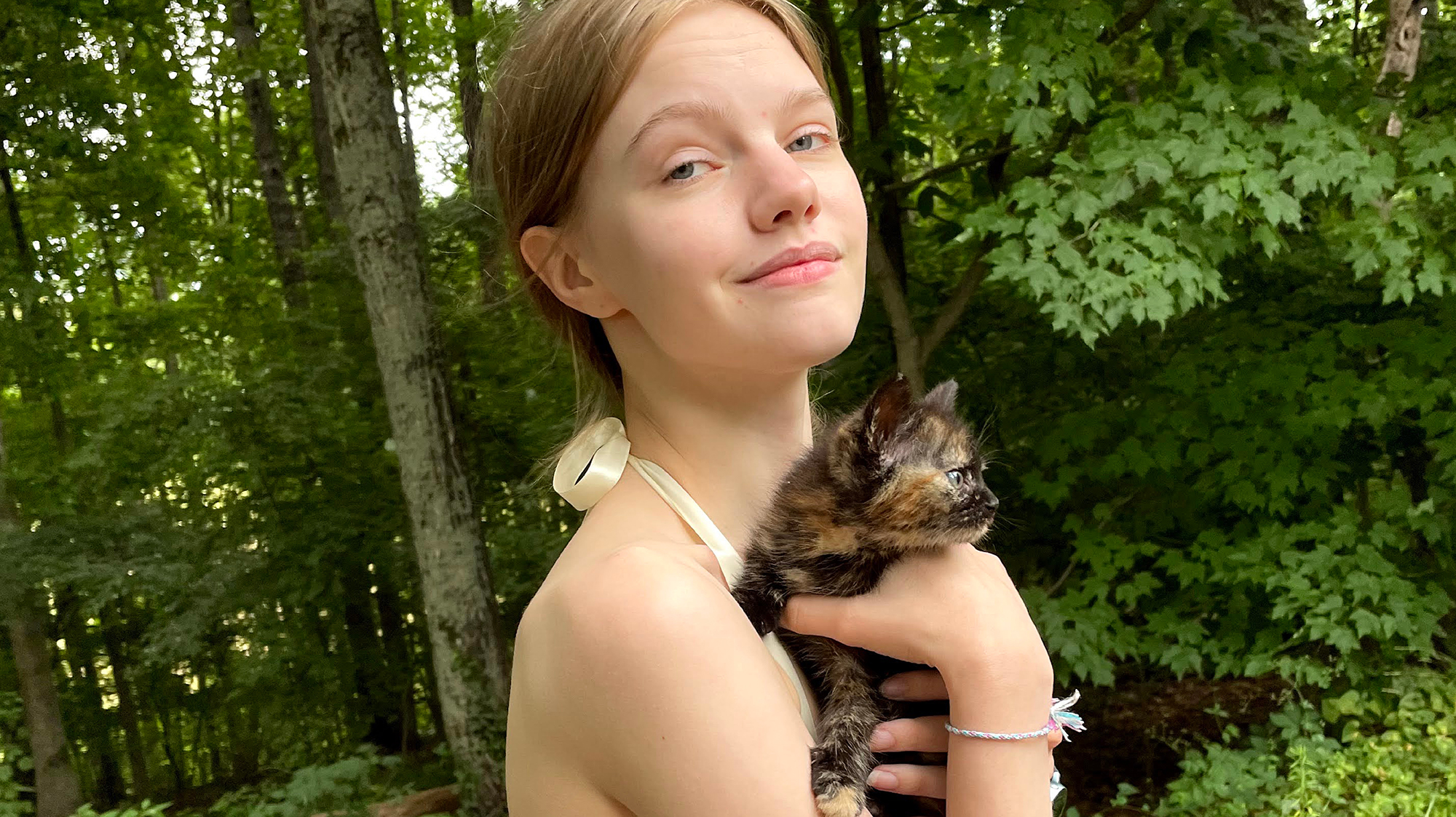 Tortie kitten with girl