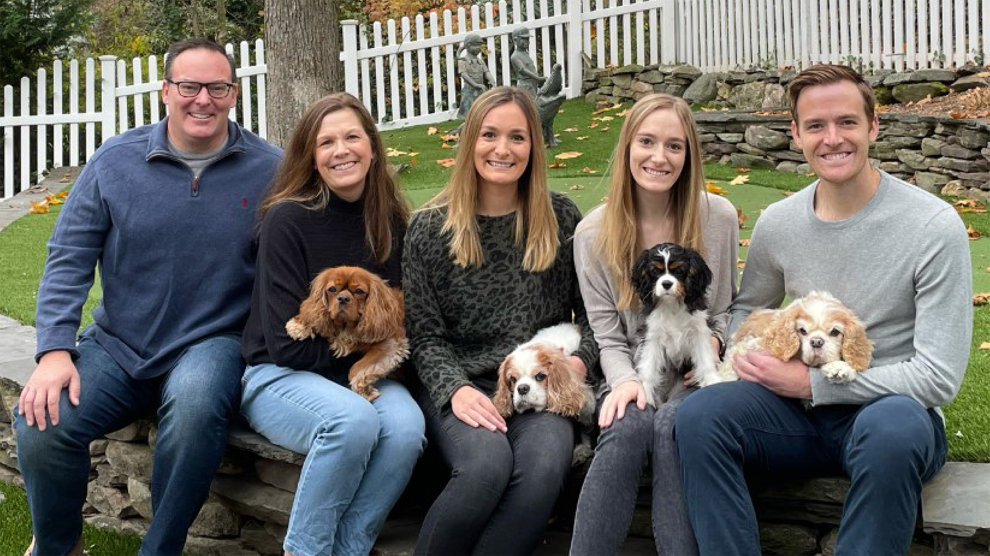 Lacy the Cavalier King Charles with family
