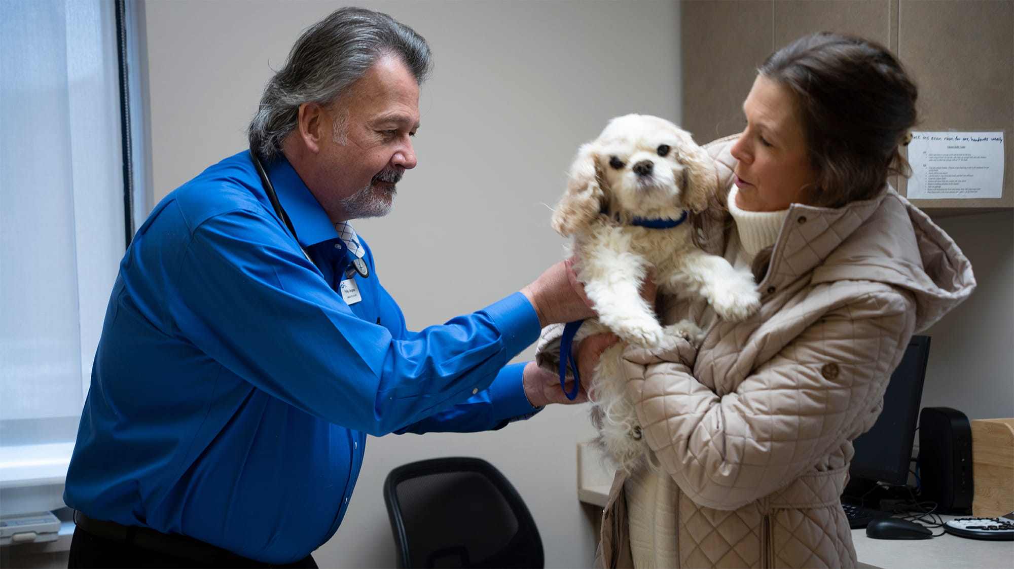 Lacy the Cavalier King Charles with Cheri Milner and Dr. Philip Bergman