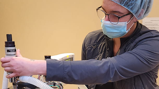 Veterinary anesthesia technician with equipment